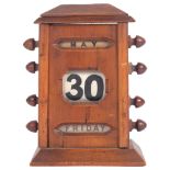 An early 20th century stained wood desk calendar, comprising day date and month, H15cm Case is