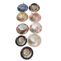 A group of English and Continental cabinet cups and saucers, including Spode and Paragon