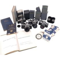 A quantity of Vintage cameras and equipment, including an Olympus OMG, and associated lens, a