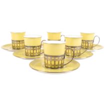 A set of 6 Shelley porcelain cans and saucers, in silver holders, H5.5cm