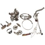 A collection of various silver jewellery, including a scrolled floral and acorn brooch, an Art