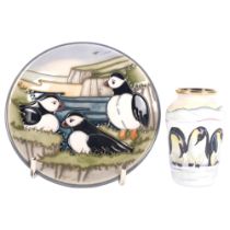 A Moorcroft Antarctica vase, with adult and infant penguin decoration, H7cm, and a Moorcroft pin