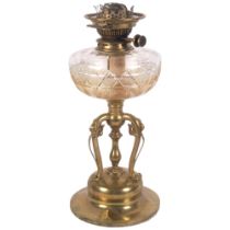 An Art Nouveau brass oil lamp with foliate decorated base, cut-glass font, with chimney, H60cm