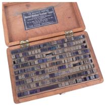 An early 20th century cased set of small printing blocks, "the accurate printing metal - bodied