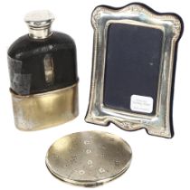 A modern sterling silver-fronted photo frame, boxed, a silver compact, and a half leather-covered