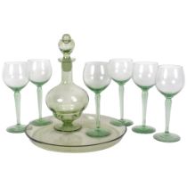 A green glass decanter and stopper, 25cm, on matching tray, with a set of 6 Hock glasses