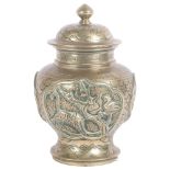 A brass Chinese preserve pot with lid, with high relief decoration in various animals, including