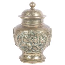 A brass Chinese preserve pot with lid, with high relief decoration in various animals, including