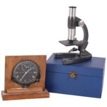 Vintage Smiths car clock on wooden stand, and a small cased microscope