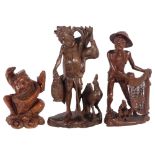 A carved hardwood figure of a fisherman, a carved figure of a Chinese warrior, and another (3),