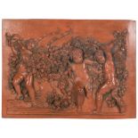 3-dimensional terracotta plaque depicting cherubs and flowers, inscribed Francoi Duqueinoy Paris