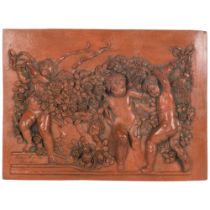 3-dimensional terracotta plaque depicting cherubs and flowers, inscribed Francoi Duqueinoy Paris
