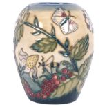 A Moorcroft 1999, "Fruit Garden" pattern design vase, H10cm, in original box, marked to the