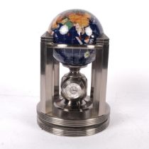 A 20th century terrestrial globe desk-top clock set, Meridian Collection "Unan", on fitted revolving