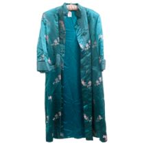 An early 20th century Chinese green silk house coat with embroidered decoration, no maker's label,