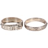 An engraved silver strap design bangle, and a floral engraved bangle (2)