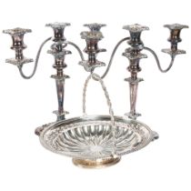 A pair of silver plated 2-branch candelabras, and a silver plated swing handled fruit dish,