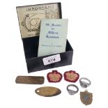 A Military War Department tag, a copy of the 99 Maxims for Military Bandsmen, 2 cloth badges, and