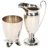 A silver helmet-shaped cream jug, and Christofle - a small plated pot on 4 splayed feet