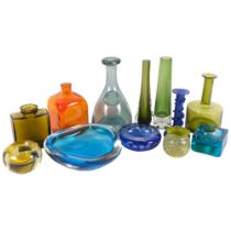 A group of decorative coloured glassware, including green vases, tallest 22cm