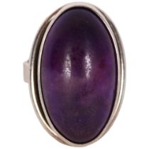 N E FROM - a Danish sterling silver ring inset with a large oval cabochon amethyst