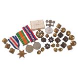 A group of 3 World War II medals, various military badges and buttons, and a King Edward VII medal