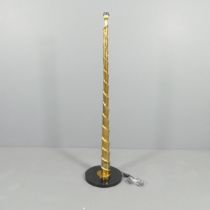 A contemporary gold painted standard lamp of spiral form, on granite base. H - 150cm.