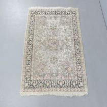 A cream-ground Persian rug. 151x94cm.