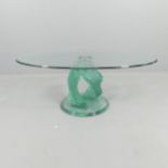 A contemporary oval glass-topped occasional table on stepped spiral base, in the manner of Danny