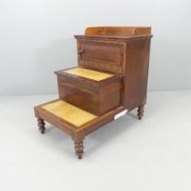 An antique mahogany step commode, with inset leather panels. 50x78x76cm. Fair used condition. Middle