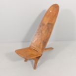 A hardwood African tribal two-section stargazing / birthing stool with carved decoration.