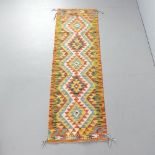 A Chobi Kilim runner. 198x60cm.