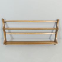 ERCOL - A mid-century elm two-tier hanging plate rack. 97x50x11cm.