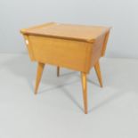 VERESTON - A teak sewing box with lifting lid and tray interior. 50x51x38cm.