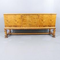 A 1920s Swedish Grace Art Deco sideboard cabinet on stand in flame birch with Neoclassical marquetry