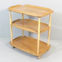 A mid-century Ercol elm model 458 three-tier tea trolley. 71x81x45cm.