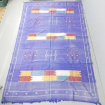 A blue-ground Moroccan Kilim carpet. 300x180cm.