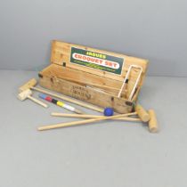 A Jacques four person croquet set in pine case. Case dimensions 110x20x27cm.