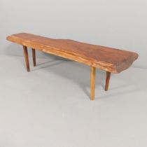 REYNOLDS OF LUDLOW - A mid-century yew-wood low coffee table, with maker's plaque. 139x40x35cm. Some