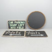 Four various black painted signs with rope surrounds. Diameter of circular sign 88cm. 2x"toilets",