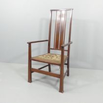 An Arts and Crafts armchair by Goodyers of Regent St, with maker's metal plaque.