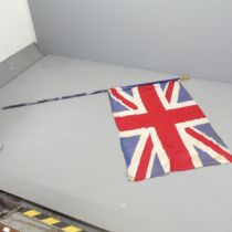 A vintage sewn Union Flag on pole. 135x96cm, pole length 230cm.