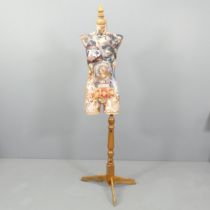 CLIVE FREDRIKSSON - a decoupage decorated mannequin of the female form on pine tripod stand,