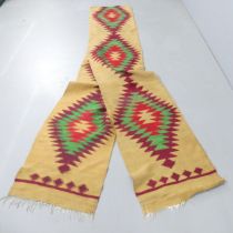 A mustard-ground Kilim runner. 540x55cm.