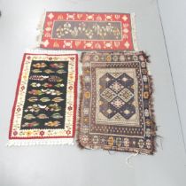 A small blue-ground Persian rug, 118x73cm, and two other mats (3).