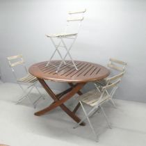 A teak slatted folding garden table, 120x73cm, and a set of four Parisienne café style folding