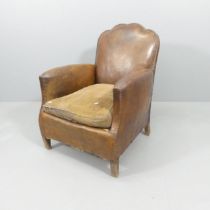 A French antique studded leather club chair. Leather in good condition, dry and cracking in places