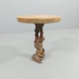 A circular live edge topped side table on burr root base. 43x50cm.