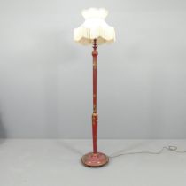 A red lacquered Chinese style standard lamp, with gold chinoiserie decoration. H - 156cm.