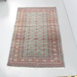 An antique blue-ground Afghan silk rug. 190x127cm.